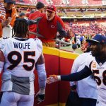 KANSAS CITY, MO - OCTOBER 28: 
A Kansas City Chiefs fan talks trash to Denver Broncos defensive end Derek Wolfe (95) while coming off the field in defeat at Arrowhead Stadium October 28, 2018. Denver Broncos linebacker Von Miller (58) pulls him away to defuse the situation. The Kansas City Chiefs won 30-23. (Photo by Andy Cross/The Denver Post via Getty Images)