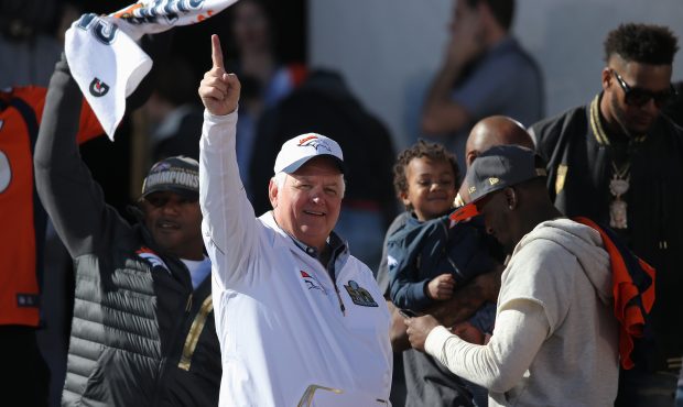 Wade Phillips defensive coordinator of the Denver Broncos celebrates on the stage as the Super Bowl...