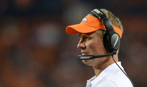 Offensive coordinator MiKe McCoy of the Denver Broncos looks on during a preseason NFL game between...