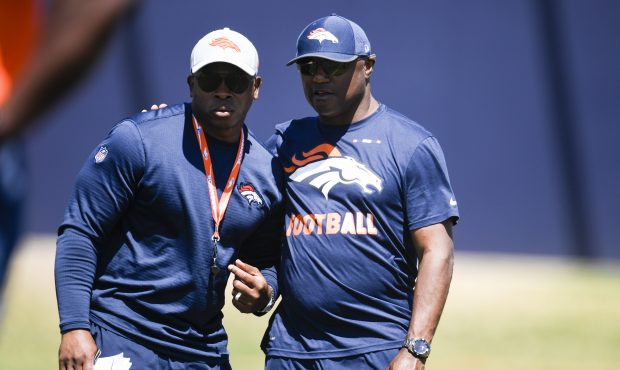 Denver Broncos head coach Vance Joseph (left) speaks with defensive coordinator Joe Woods during th...