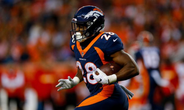 DENVER, CO - OCTOBER 1:  Running back Royce Freeman #28 of the Denver Broncos carries the ball agai...
