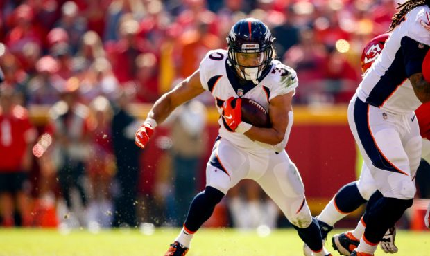 Phillip Lindsay #30 of the Denver Broncos breaks in to the open field during the first half of the ...