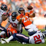 DENVER, CO - NOVEMBER 4:  Running back Devontae Booker #23 of the Denver Broncos fumbles the ball in the second quarter of a game against the Houston Texans at Broncos Stadium at Mile High on November 4, 2018 in Denver, Colorado. The ball was recovered by strong safety Justin Reid #20 of the Houston Texans. (Photo by Justin Edmonds/Getty Images)
