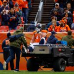 Center Matt Paradis #61 of the Denver Broncos puts his hand on his head as he is carted of the field with an injury in the second quarter of a game against the Houston Texans at Broncos Stadium at Mile High on November 4, 2018 in Denver, Colorado. (Photo by Justin Edmonds/Getty Images)