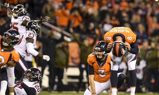 Brandon McManus (8) reacts to his missed game-winning field goal attempt against the Houston Texans...