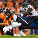 DENVER, CO - NOVEMBER 4:  Quarterback Case Keenum #4 of the Denver Broncos is sacked by outside linebacker Jadeveon Clowney #90 of the Houston Texans in the fourth quarter of a game at Broncos Stadium at Mile High on November 4, 2018 in Denver, Colorado. (Photo by Dustin Bradford/Getty Images)
