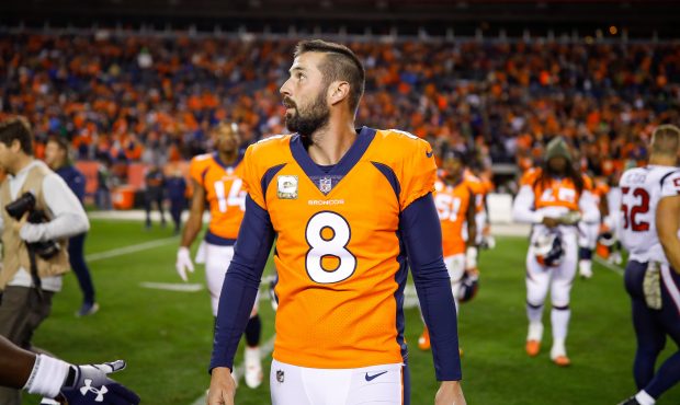 Kicker Brandon McManus #8 of the Denver Broncos walks off the field after a 17-19 loss to the Houst...