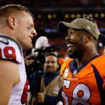 DENVER, CO - NOVEMBER 4:  Outside linebacker Von Miller #58 of the Denver Broncos has a word with defensive end J.J. Watt #99 of the Houston Texans after a 19-17 Texans' win at Broncos Stadium at Mile High on November 4, 2018 in Denver, Colorado. (Photo by Justin Edmonds/Getty Images)
