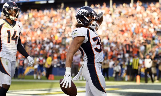 Running back Phillip Lindsay #30 of the Denver Broncos gives the Mile High Salute as his TD makes t...