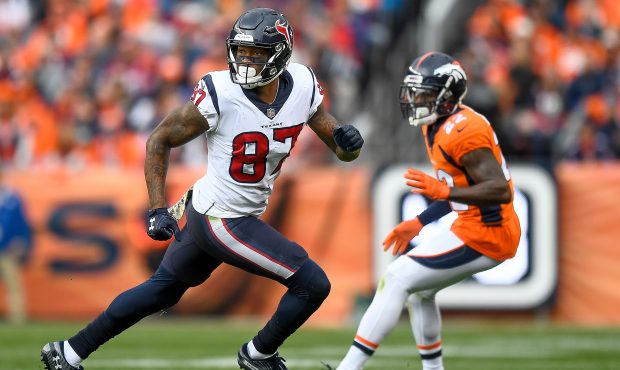 Wide receiver Demaryius Thomas #87 of the Houston Texans runs a route under coverage by defensive b...