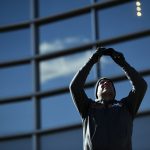 A Broncos fan takes pictures of the Denver skyline outside of the stadium prior to the game on Sunday, November 25 at Broncos Stadium at Mile High. The Denver Broncos hosted the Pittsburgh Steelers. (Photo by Eric Lutzens/The Denver Post via Getty Images)