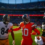 Wide receiver Emmanuel Sanders #10 of the Denver Broncos talks with wide receiver JuJu Smith-Schuster #19 and wide receiver Antonio Brown #84 of the Pittsburgh Steelers as players warm up before a game at Broncos Stadium at Mile High on November 25, 2018 in Denver, Colorado. (Photo by Justin Edmonds/Getty Images)