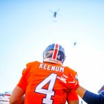 Quarterback Case Keenum #4 of the Denver Broncos stands on the field as armed forces helicopters perform a flyover during the performance of the national anthem before a game against the Pittsburgh Steelers at Broncos Stadium at Mile High on November 25, 2018 in Denver, Colorado. (Photo by Justin Edmonds/Getty Images)