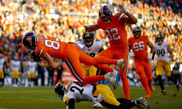Tight end Matt LaCosse #83 of the Denver Broncos dives into the end zone with a second quarter touc...