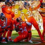 Strong safety Will Parks #34 of the Denver Broncos celebrates with teammates after forcing a fumble and preventing a second quarter touchdown against the Pittsburgh Steelers at Broncos Stadium at Mile High on November 25, 2018 in Denver, Colorado. (Photo by Justin Edmonds/Getty Images)