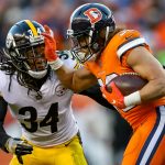 Running back Phillip Lindsay #30 of the Denver Broncos carries the ball against Terrell Edmunds #34 of the Pittsburgh Steelers in the third quarter of a game at Broncos Stadium at Mile High on November 25, 2018 in Denver, Colorado. (Photo by Matthew Stockman/Getty Images)