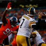 Quarterback Ben Roethlisberger #7 of the Pittsburgh Steelers passes from the end zone under pressure by defensive end Shelby Harris #96 of the Denver Broncos in the third quarter of a game at Broncos Stadium at Mile High on November 25, 2018 in Denver, Colorado. (Photo by Justin Edmonds/Getty Images)