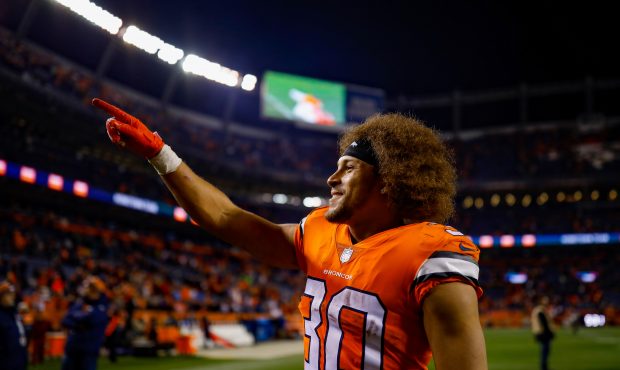 Running back Phillip Lindsay #30 of the Denver Broncos walks off the field after a 24-17 win over t...