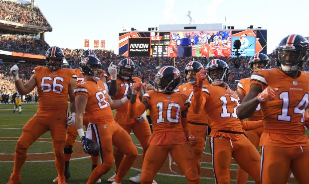 Denver Broncos tight end Matt LaCosse #83 and the offense celebrate his touchdown making the score ...