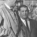 NOV 22 1962, NOV 23 1962; Dejected Bronco Coach; Coach Jack Faulkner (right) of the Denver Bronco, shows his unhappiness with the proceedings as his club blows a 46-45 American Football League game to the New York Titans. Assistant Coach Mac Speedie is at left.; Faulkner, Jack;  (Photo By Bill Peters/The Denver Post via Getty Images)