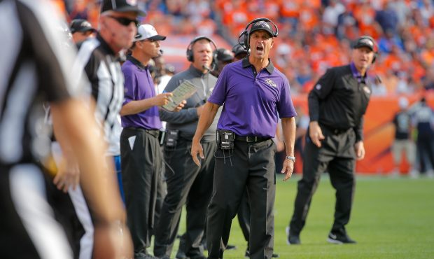 Head coach John Harbaugh of the Baltimore Ravens reacts in the fourth quarter of a game against the...