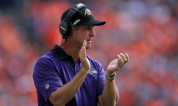 Head coach John Harbaugh of the Baltimore Ravens leads his team against the Denver Broncos at Sport...