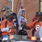DENVER, CO - FEBRUARY 09: The Denver Broncos were celebrating their Super Bowl victory with a parade through the streets of Denver on Tuesday, February 09, 2016. At Union Station  #88 Demaryius Thomas, right, holds a bottle of champagne as he rides with #10 Emmanuel  Sanders, left.  (Photo by Cyrus McCrimmon/ The Denver Post)