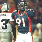 DENVER, CO - NOVEMBER 24:  Denver Broncos defensive end Alfred Williams(R) reacts after the Oakland Raiders lost yardage on a play while quarterback Jeff George(L) walks away 24 November at Mile High Stadium in Denver, CO.  (Photo credit should read DOUG COLLIER/AFP/Getty Images)