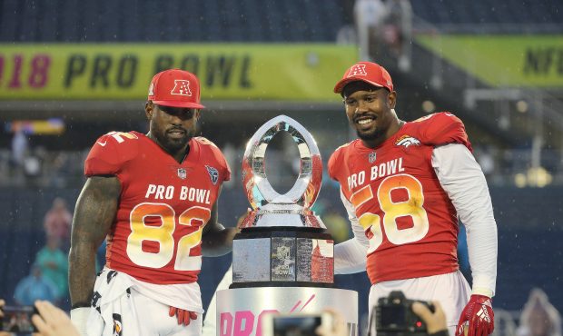 Game MVP honorees Delanie Walker #82 of the Tennessee Titans and Von Miller #58 of the Denver Bronc...