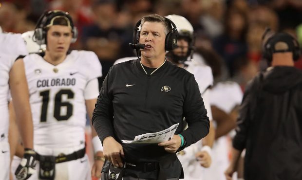 Head coach Mike MacIntyre of the Colorado Buffaloes watches from the sidelines during the college f...