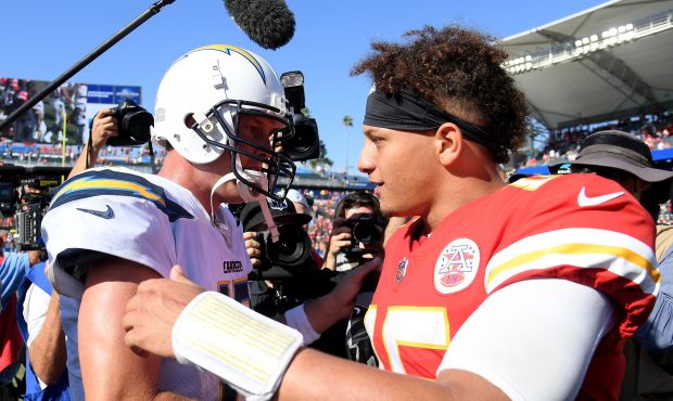 Patrick Mahomes #15 of the Kansas City Chiefs and Philip Rivers #17 of the Los Angeles Chargers sha...