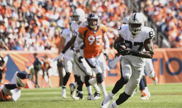 Jared Cook (87) of the Oakland Raiders makes a catch and runs up field during the second quarter ag...