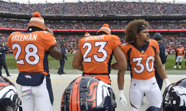 Phillip Lindsay (30) of the Denver Broncos stands with Devontae Booker (23) and Royce Freeman (28) ...