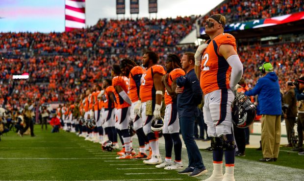 Offensive tackle Garett Bolles #72 of the Denver Broncos stands on the field with teammates during ...