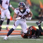 Phillip Lindsay #30 of the Denver Broncos slips out of an attempted tackle by Vontaze Burfict #55 of the Cincinnati Bengals during the second quarter at Paul Brown Stadium on December 2, 2018 in Cincinnati, Ohio. (Photo by John Grieshop/Getty Images)