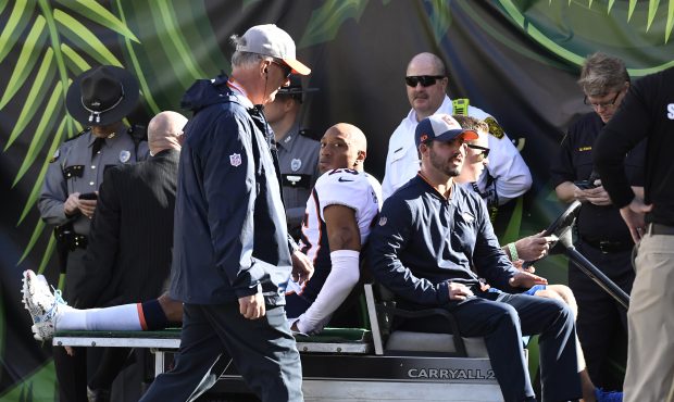 Denver Broncos cornerback Chris Harris Jr (25) gets carted off to the locker room to be checked out...