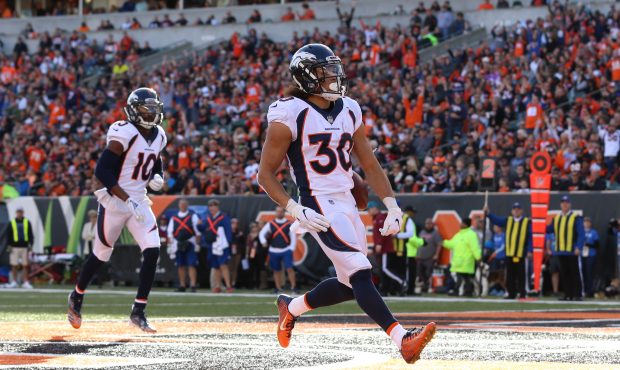 Denver Broncos running back Phillip Lindsay (30) carries the ball for a touchdown during the game a...