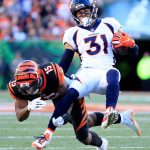 Justin Simmons #31 of the Denver Broncos is tackled by John Ross #15 of the Cincinnati Bengals during the third quarter at Paul Brown Stadium on December 2, 2018 in Cincinnati, Ohio. (Photo by Andy Lyons/Getty Images)