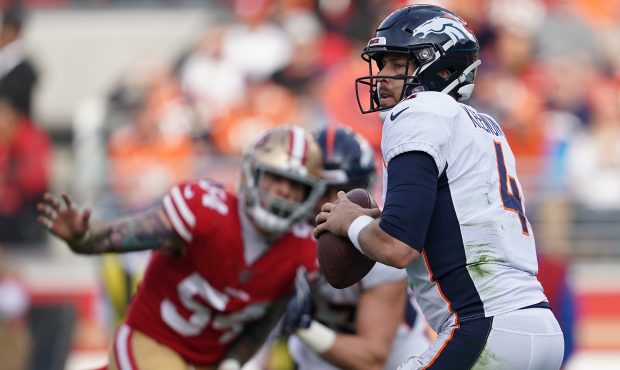 Case Keenum #4 of the Denver Broncos looks to pass against the San Francisco 49ers during their NFL...