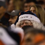 A fan watches in the third quarter as the Denver Broncos played the Cleveland Browns at Broncos Stadium at Mile High. (Photo by Andy Cross/The Denver Post via Getty Images)