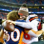 Running back Phillip Lindsay #30 of the Denver Broncos and quarterback Baker Mayfield #6 of the Cleveland Browns embrace on the field after the Browns' 17-16 win over the Denver Broncos at Broncos Stadium at Mile High on December 15, 2018 in Denver, Colorado. (Photo by Dustin Bradford/Getty Images)