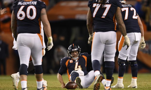 Case Keenum (4) of the Denver Broncos after being sacked on the final play of the game during the f...