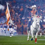 Ann Judge rides Denver Broncos mascot Thunder onto the field before a game between the Denver Broncos and the Cleveland Browns at Broncos Stadium at Mile High on December 15, 2018 in Denver, Colorado. (Photo by Justin Edmonds/Getty Images)