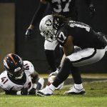 Oakland Raiders wide receiver Dwayne Harris (17) picks up the ball from Denver Broncos cornerback Isaac Yiadom (41) and eventually runs it back for a 99-yard punt return for a touchdown in the first quarter at the Oakland Alameda Coliseum December 24, 2018. Denver Broncos wide receiver Andre Holmes (19) (not pictured) tried to pin the ball down on the one-yard line to Yiadom, Yiadom lost control, Harris picked the ball up and ran for ta touchdown. (Photo by Andy Cross/The Denver Post via Getty Images)