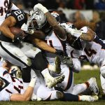 Doug Martin #28 of the Oakland Raiders rushes with the ball against the Denver Broncos during their NFL game at Oakland-Alameda County Coliseum on December 24, 2018 in Oakland, California. (Photo by Robert Reiners/Getty Images)