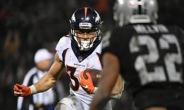 Phillip Lindsay #30 of the Denver Broncos rushes with the ball against the Oakland Raiders during t...