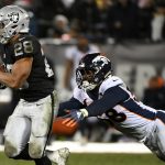 Doug Martin #28 of the Oakland Raiders breaks a tackle of Von Miller #58 of the Denver Broncos during their NFL game at Oakland-Alameda County Coliseum on December 24, 2018 in Oakland, California. (Photo by Robert Reiners/Getty Images)