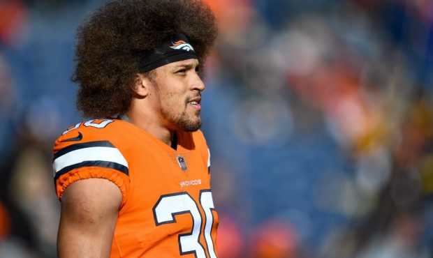Running back Phillip Lindsay #30 of the Denver Broncos stands on the field during player warm ups b...