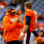Head coach Vance Joseph of the Denver Broncos greets quarterback Case Keenum #4 on the field before a game against the Los Angeles Chargers at Broncos Stadium at Mile High on December 30, 2018 in Denver, Colorado. (Photo by Justin Edmonds/Getty Images)