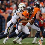 Quarterback Case Keenum #4 of the Denver Broncos is sacked by defensive end Joey Bosa #99 of the Los Angeles Chargers in the second quarter of a game at Broncos Stadium at Mile High on December 30, 2018 in Denver, Colorado. (Photo by Matthew Stockman/Getty Images)